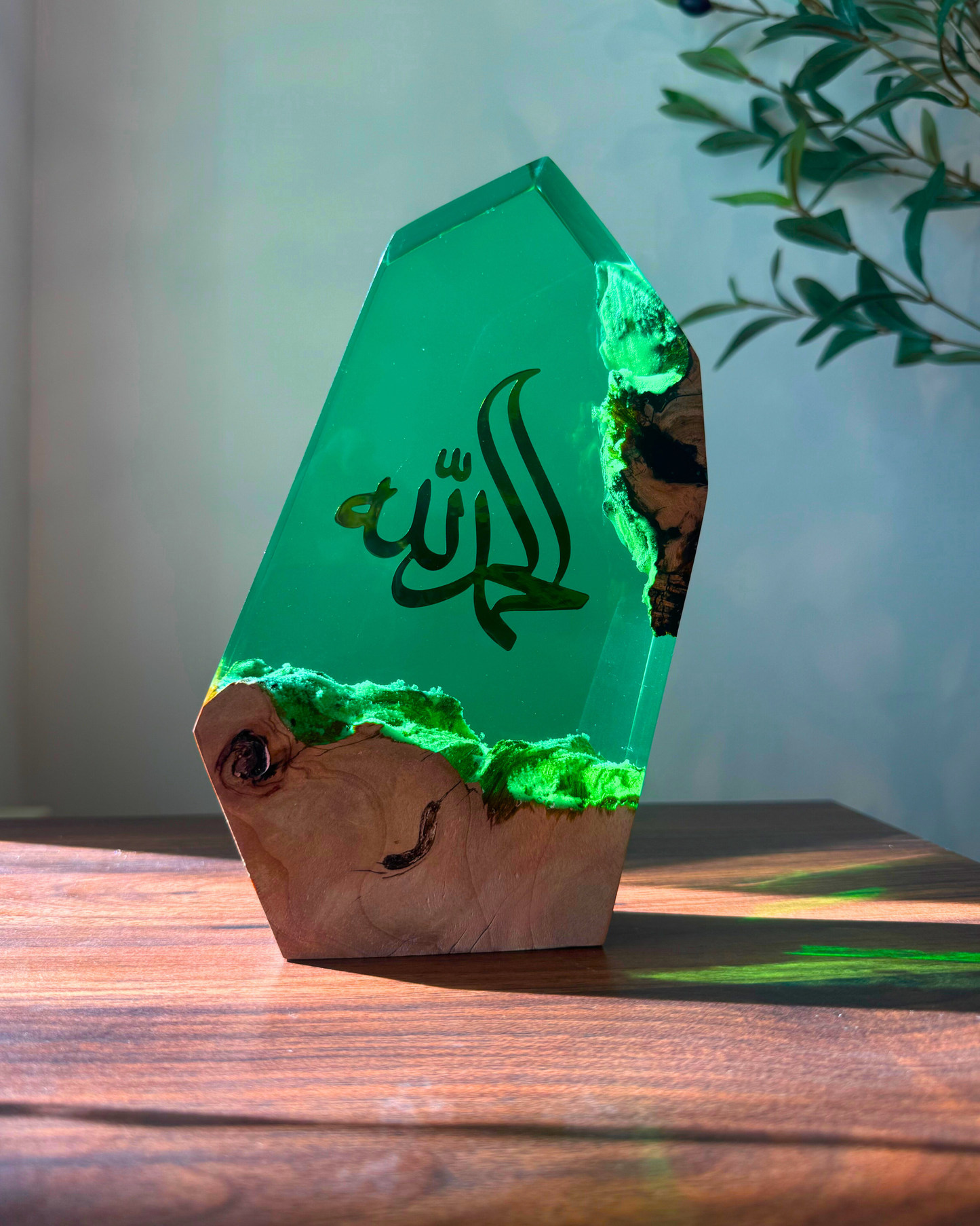 Arabic calligraphy Islamic art in turquoise resin, faith-inspired design.